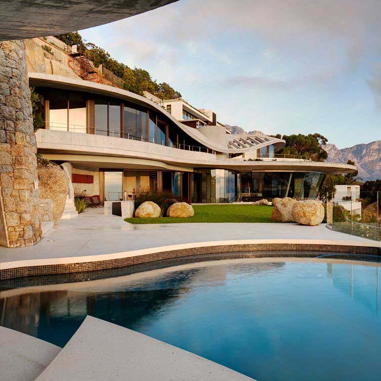 Dual waterproofed rimflow pool over living space.